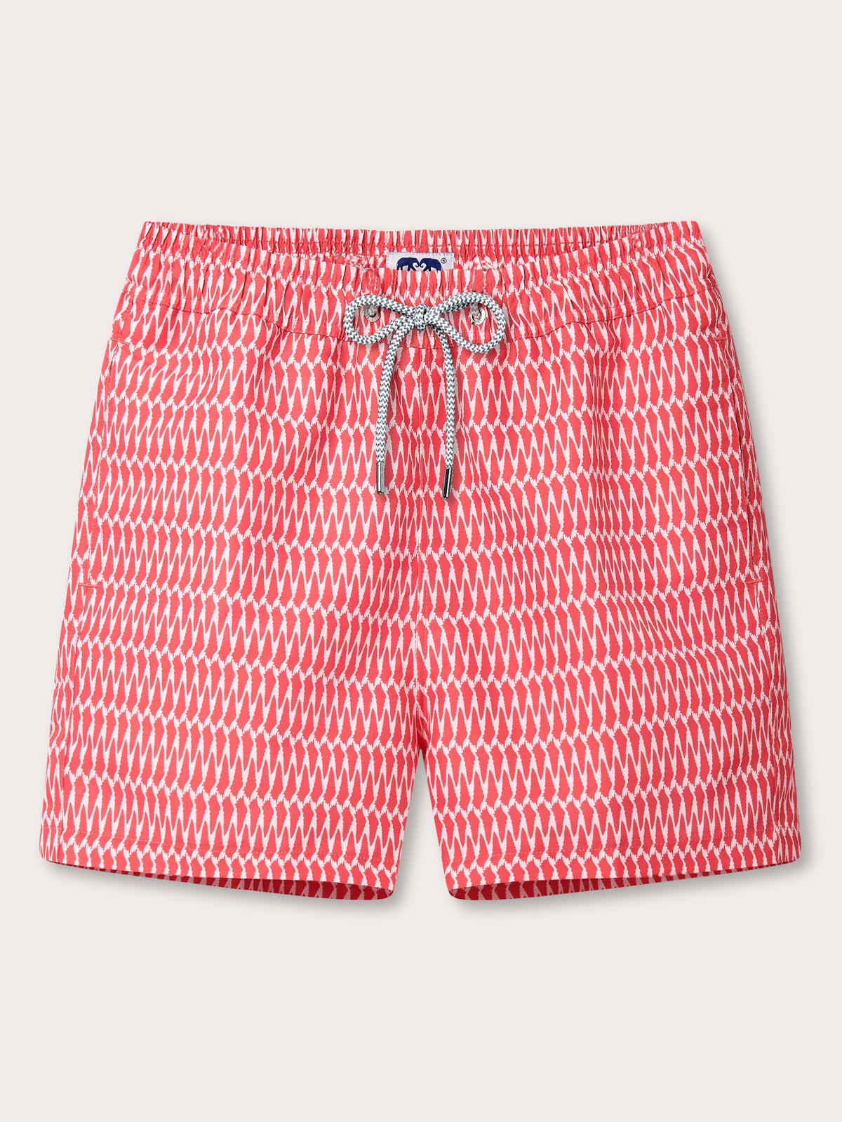 White and red print swim shorts by Love Brand with drawstring waist and pockets.