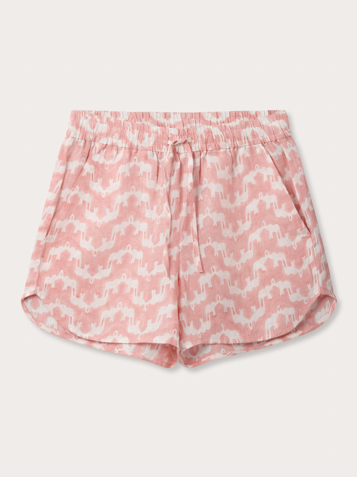 Front view of Womens Elephant Palace Strawberry Musha Linen Shorts. Pink and white shorts with elastic waist, drawstring and handy pockets. made from 100% linen  hand block-printed by Indian artisans.